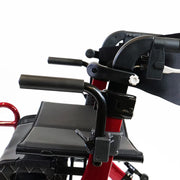 Close-up of a red and black rollator with a focus on the seat and handlebars.