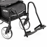 Black rollator footrest with extendable handle on a white background