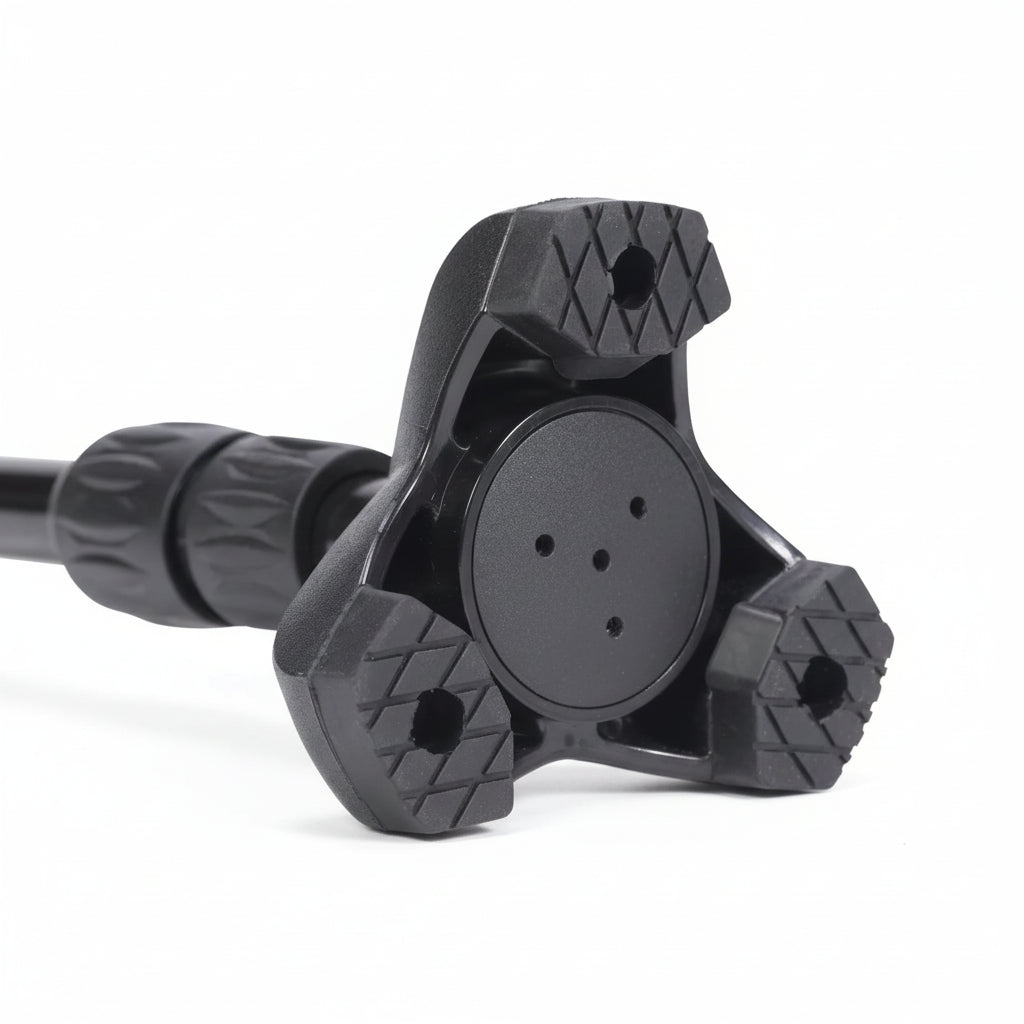 Close-up of a black metal clamp on a white background