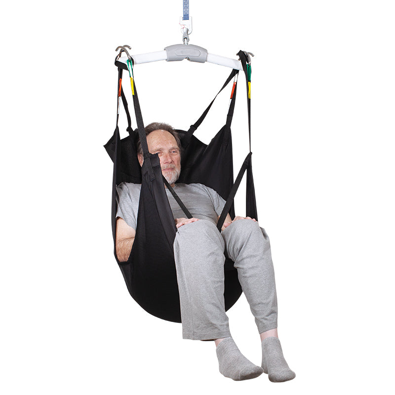 Person using a black medical sling on a white background